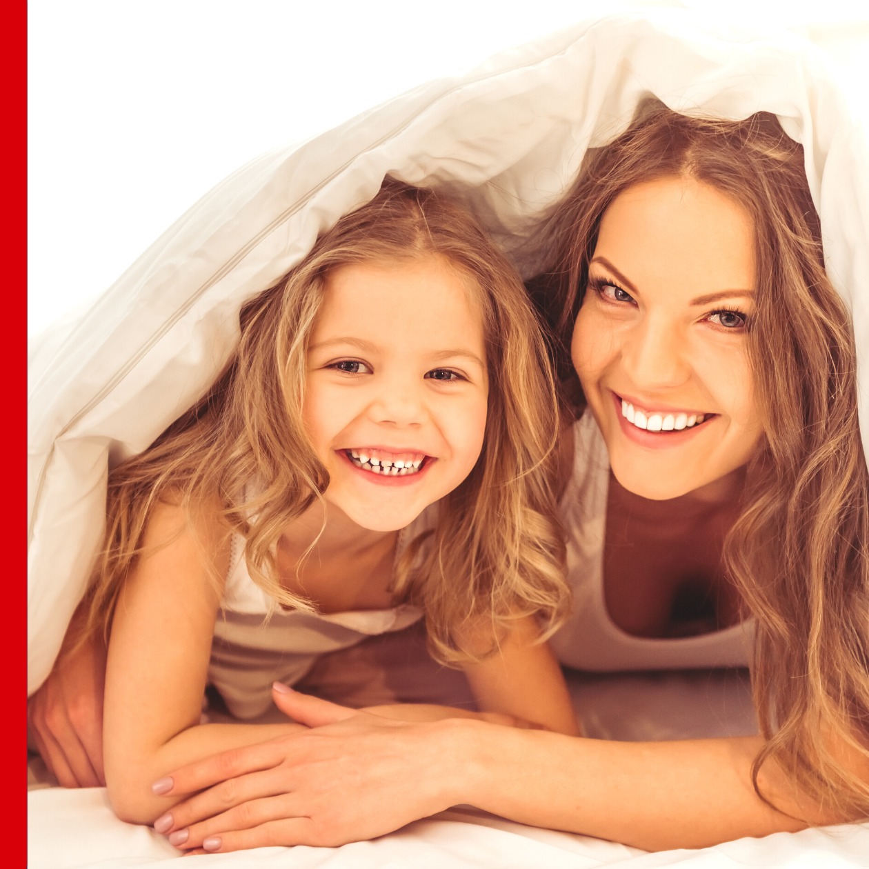 woman and child playing in blanket fort