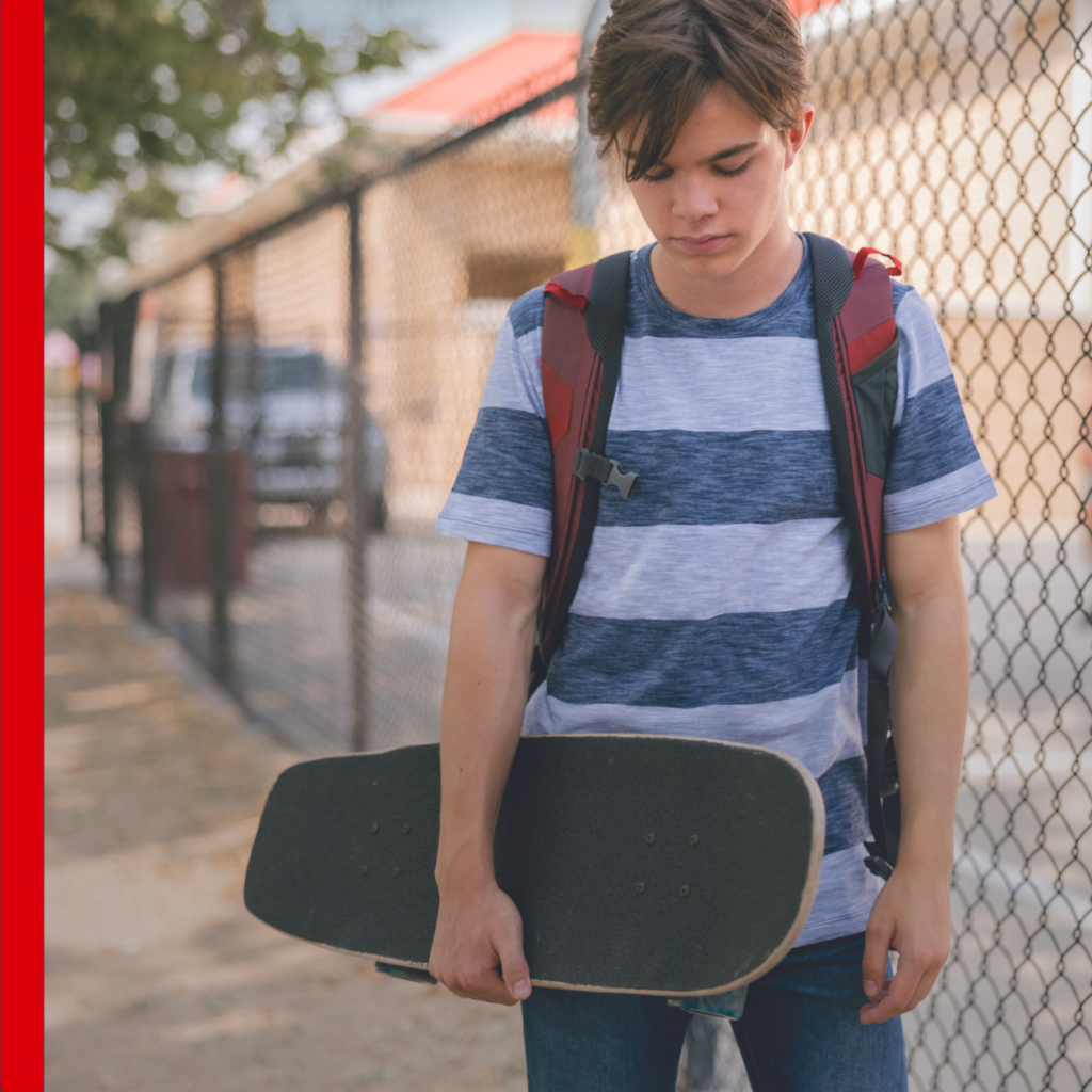 young male holding skateboard, blog header