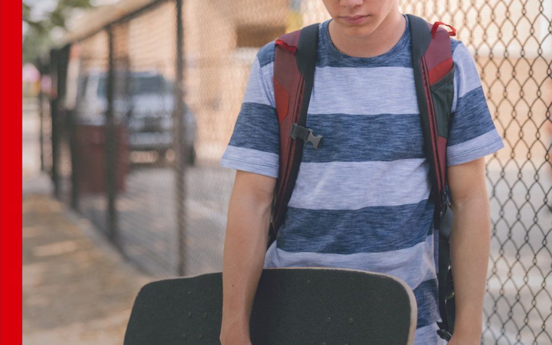 young male holding skateboard, blog header