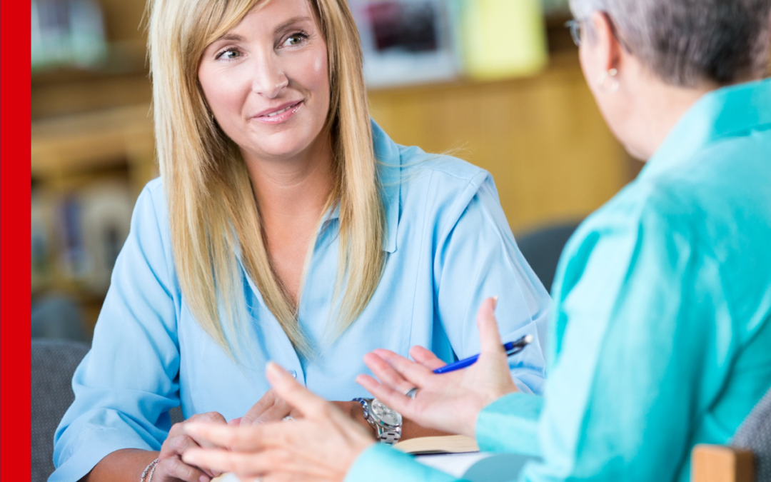 adults speaking together at table, blog header