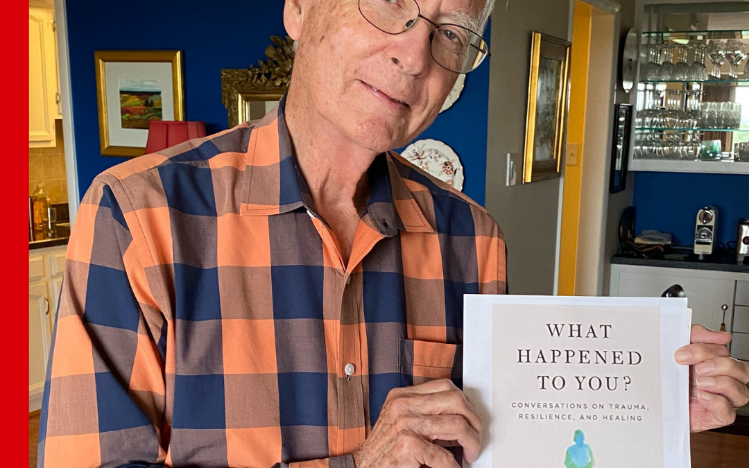CASA staff holding What Happened To You by Bruce D Perry