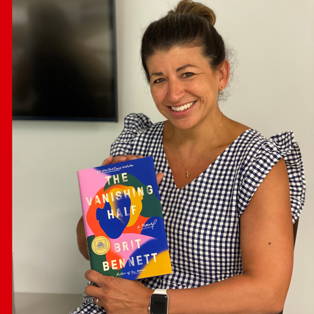 CASA staff holding The Vanishing Half by Brit Bennett