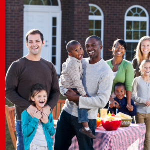 Diverse group of adults and children at outdoor meal, blog header